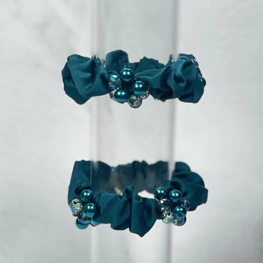 Teal fabric crystal studded hair ties with decorative blue pearls and clear crystals