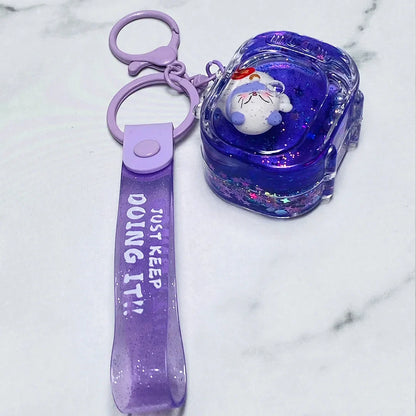 Purple fancy key chain with a cute white sleeping bear inside a glittery resin charm and a strap that says Just Keep Doing It