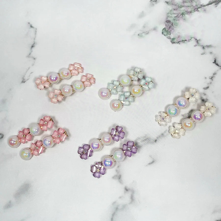 Set of colorful fancy pearl flower hair pins with pink, purple, white, and silver floral designs