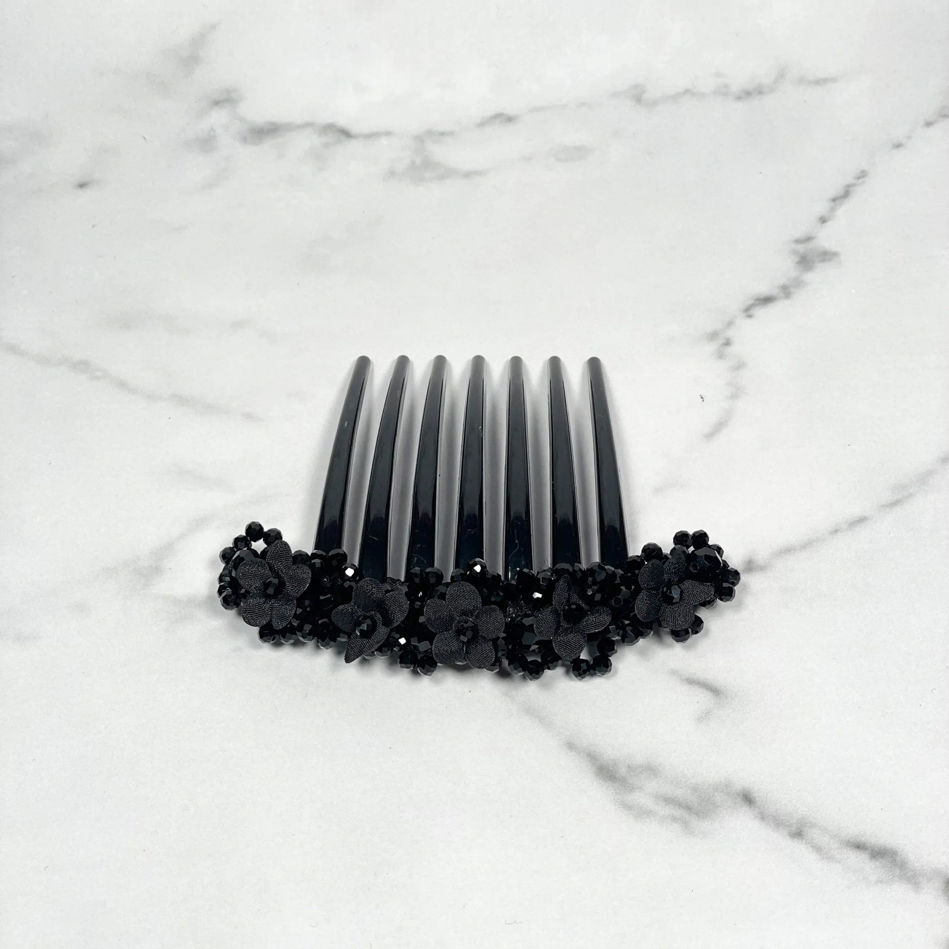 Black floral beaded hair comb clips with intricate flower and bead design on black comb base