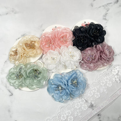 Assorted colorful floral organza hair pins in pastel and dark shades with decorative beads