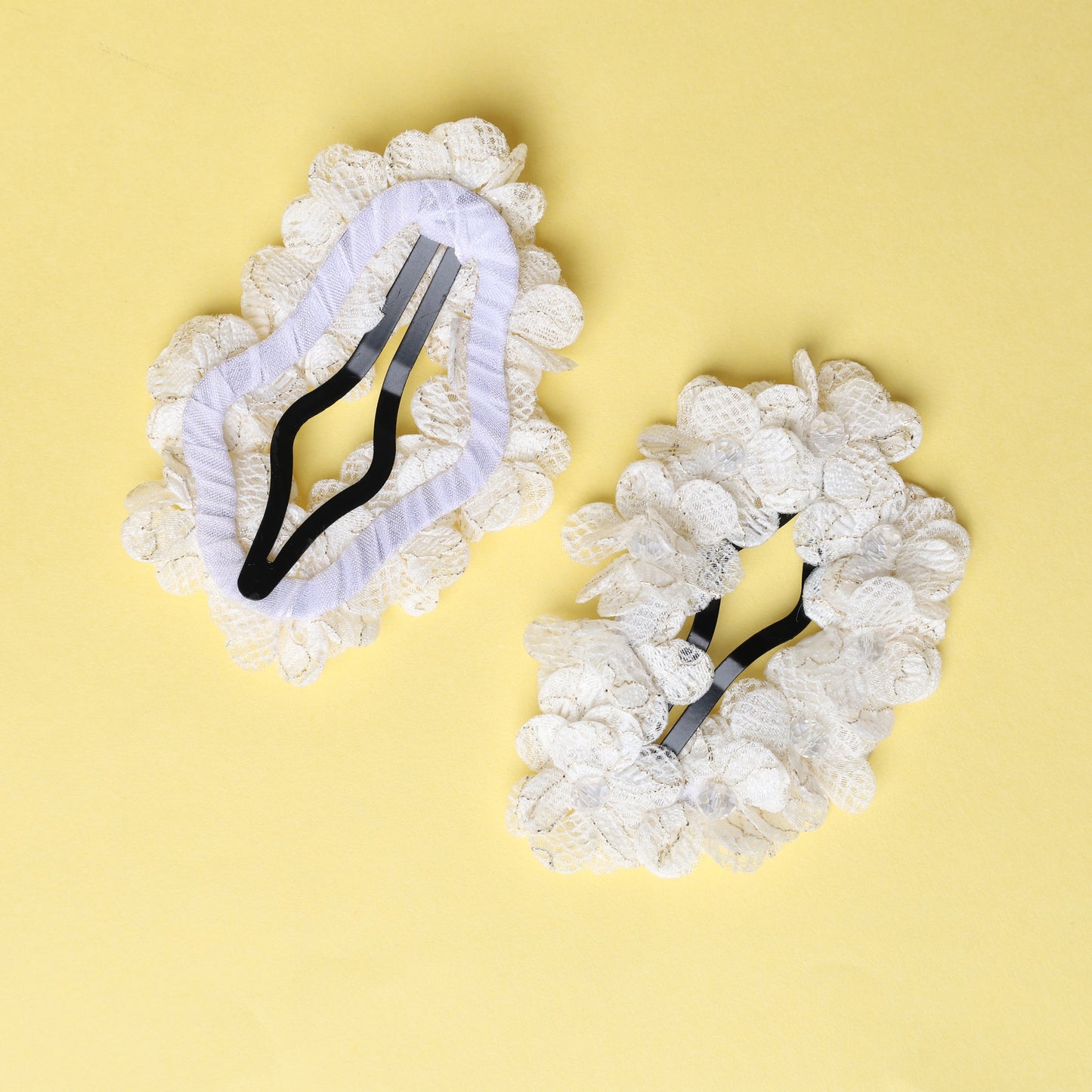 White flower crystal hair pins with lace petals on a yellow background