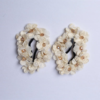 Pair of flower crystal hair pins with delicate white fabric flowers and light brown crystal centers