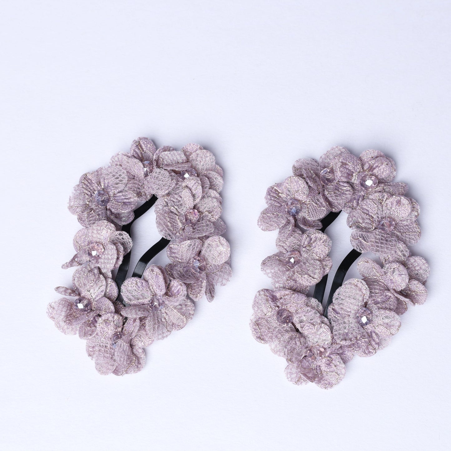 Pair of delicate flower crystal hair pins with light purple floral design and sparkling crystals