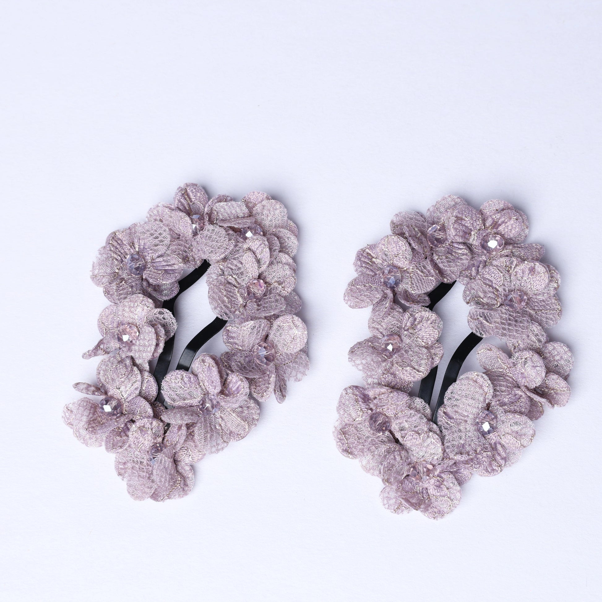 Pair of delicate flower crystal hair pins with light purple floral design and sparkling crystals