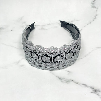 Grey lacy hairband with intricate floral lace design for elegant styling