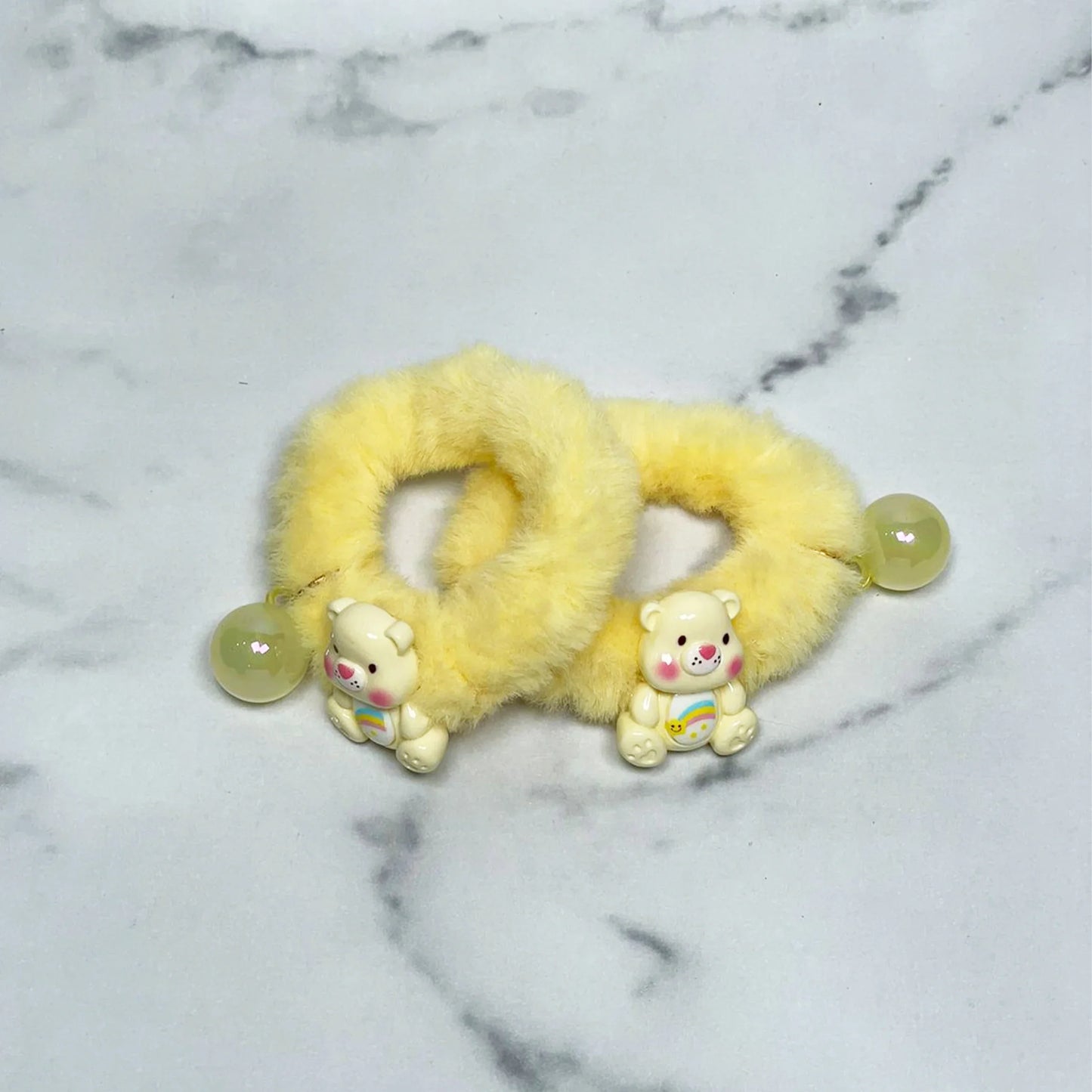 Yellow kids furry hair ties with cute bear charms and round bead accents for children