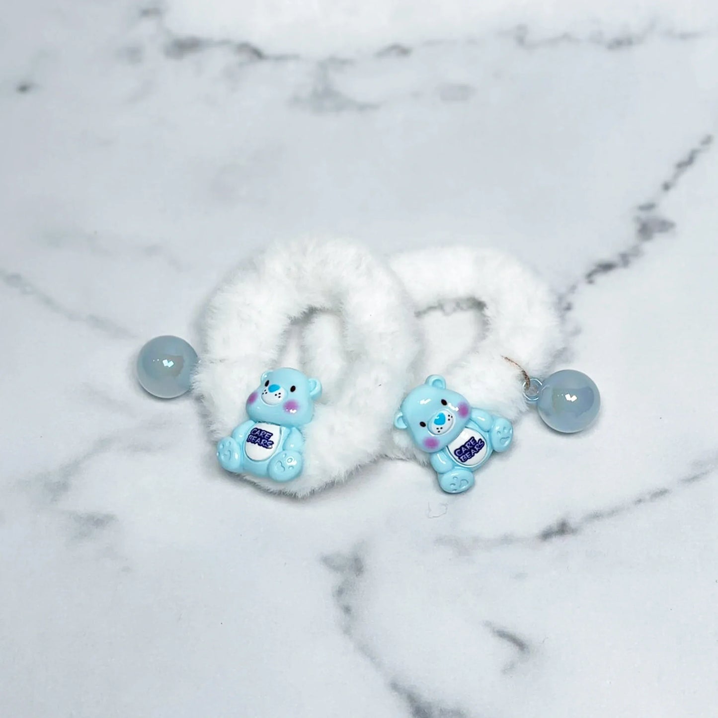 White kids furry hair ties with blue bear charms and round beads for children