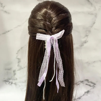 Lace satin pearl hair ties with delicate lace and pearls tied in a bow on dark brown hair