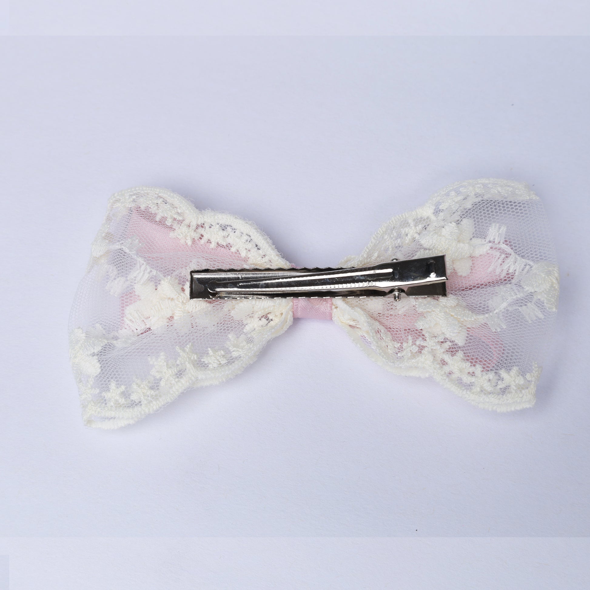 Lacy Bows with Ribbon hair clip featuring delicate white lace and pink fabric detail