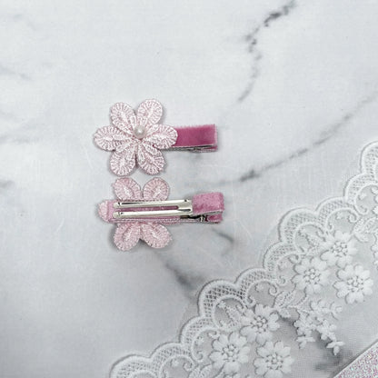 Lacy Flower Alligator Hair Pins with Beads in pink lace design on a marble surface with lace fabric