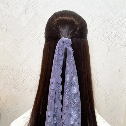 Lilac lacy hair scarf tied on long dark brown hair from Bella Luxe