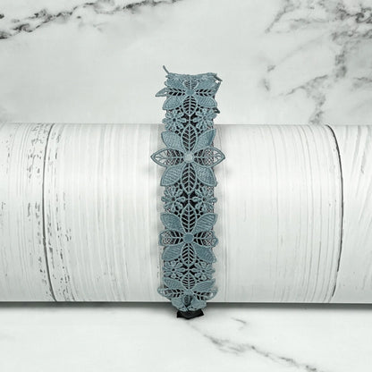 Medium broad colored hair bands with intricate floral lace design in soft blue shade