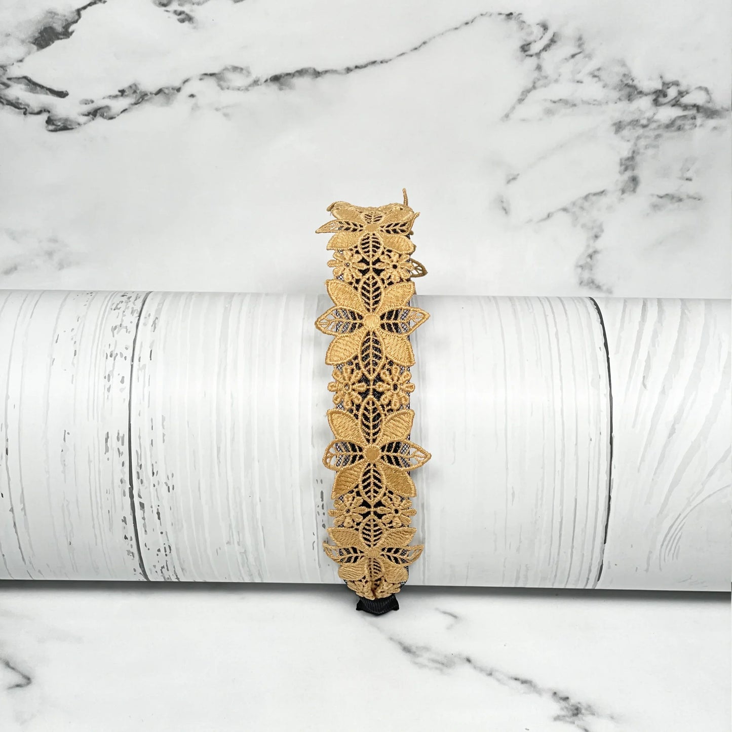 Medium broad colored hair bands with intricate floral lace design in tan color