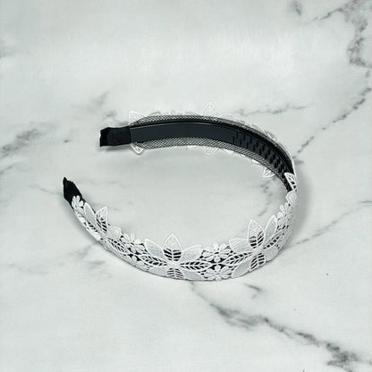 White lace medium broad colored hair bands with floral design on black base