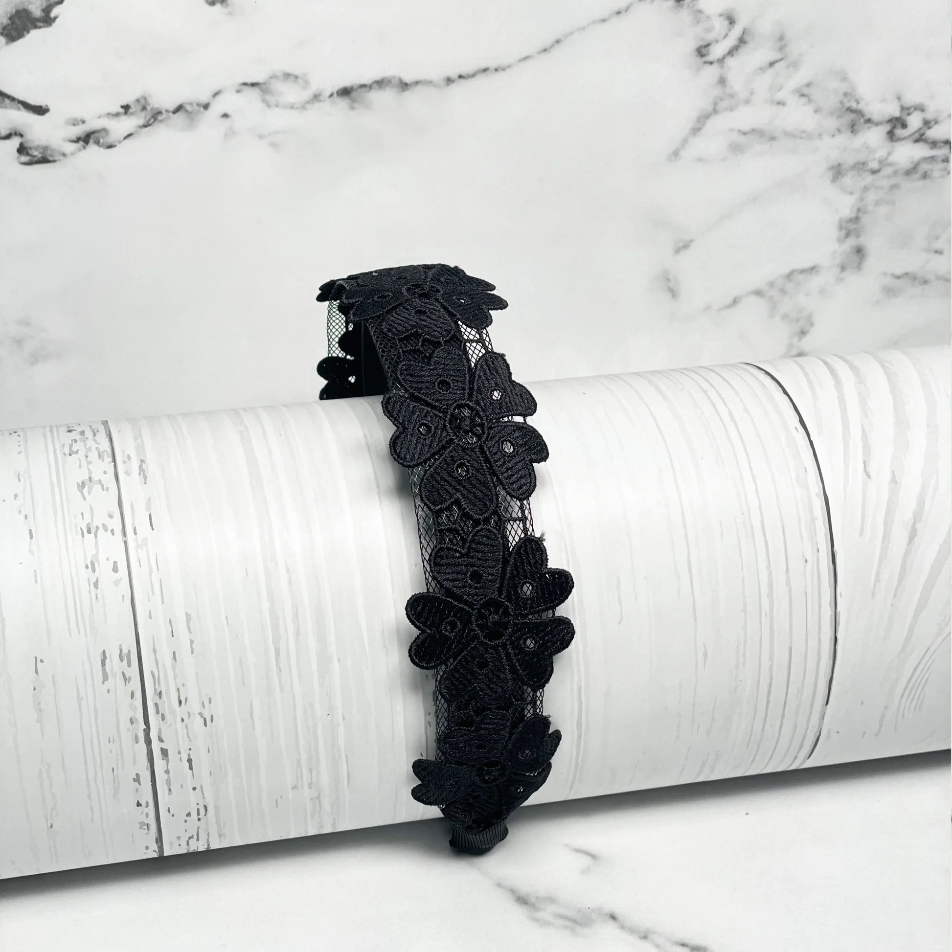 Black Medium Broad Lacy Floral Hairbands with intricate floral lace design on white background