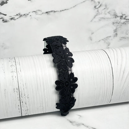 Black Medium Broad Lacy Floral Hairbands with intricate floral lace design on white background