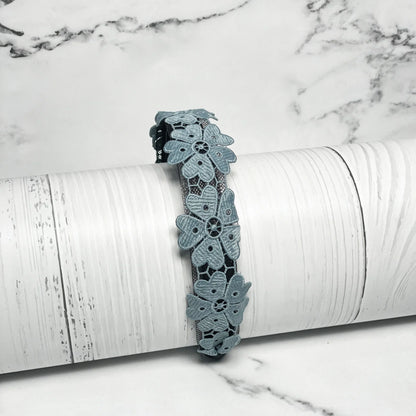 Medium Broad Lacy Floral Hairbands in blue with intricate flower lace design on white background