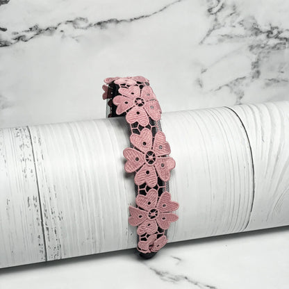 Pink Medium Broad Lacy Floral Hairbands with intricate floral lace design displayed on white wooden background
