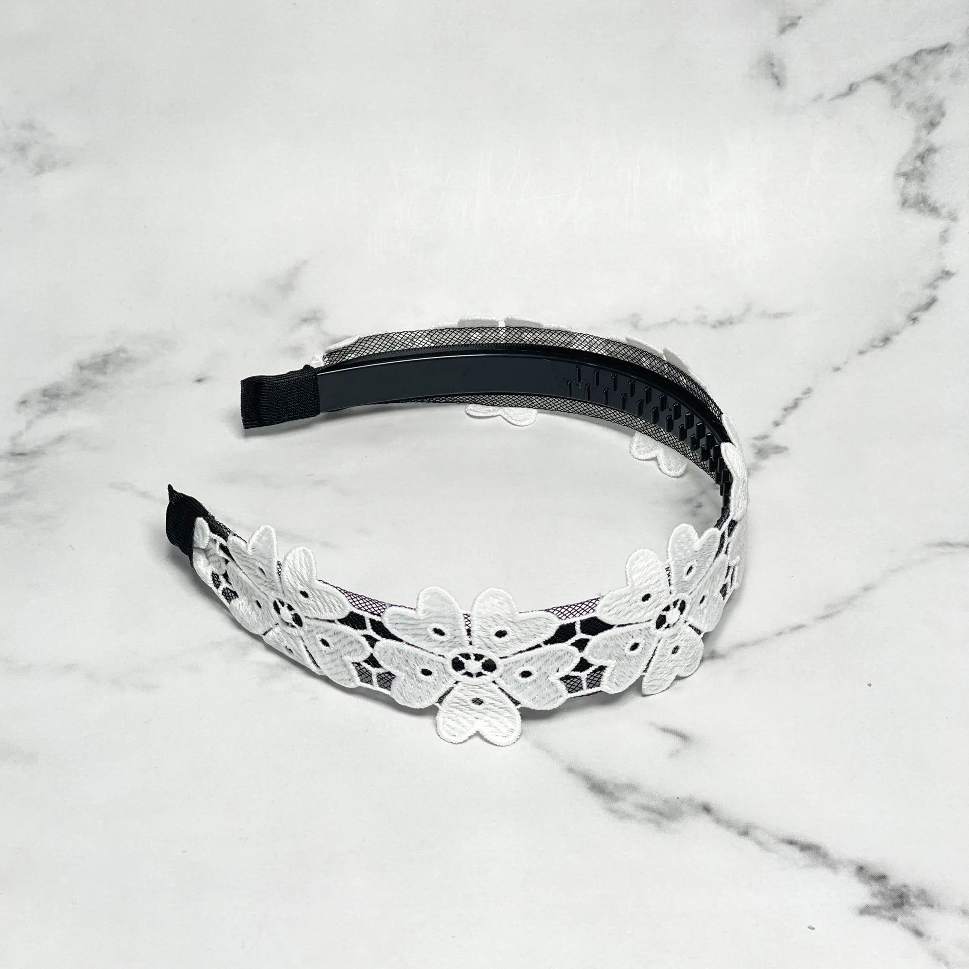 Black hairband adorned with white floral lace design Medium Broad Lacy Floral Hairbands