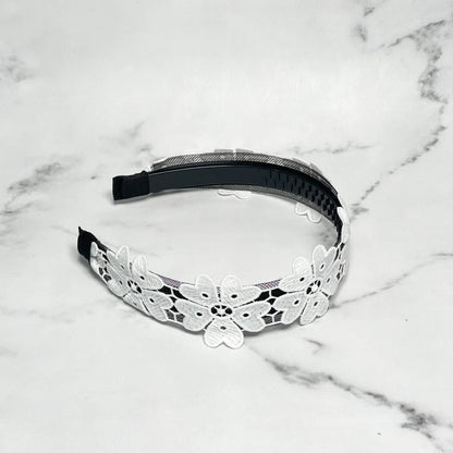 Black hairband adorned with white floral lace design Medium Broad Lacy Floral Hairbands