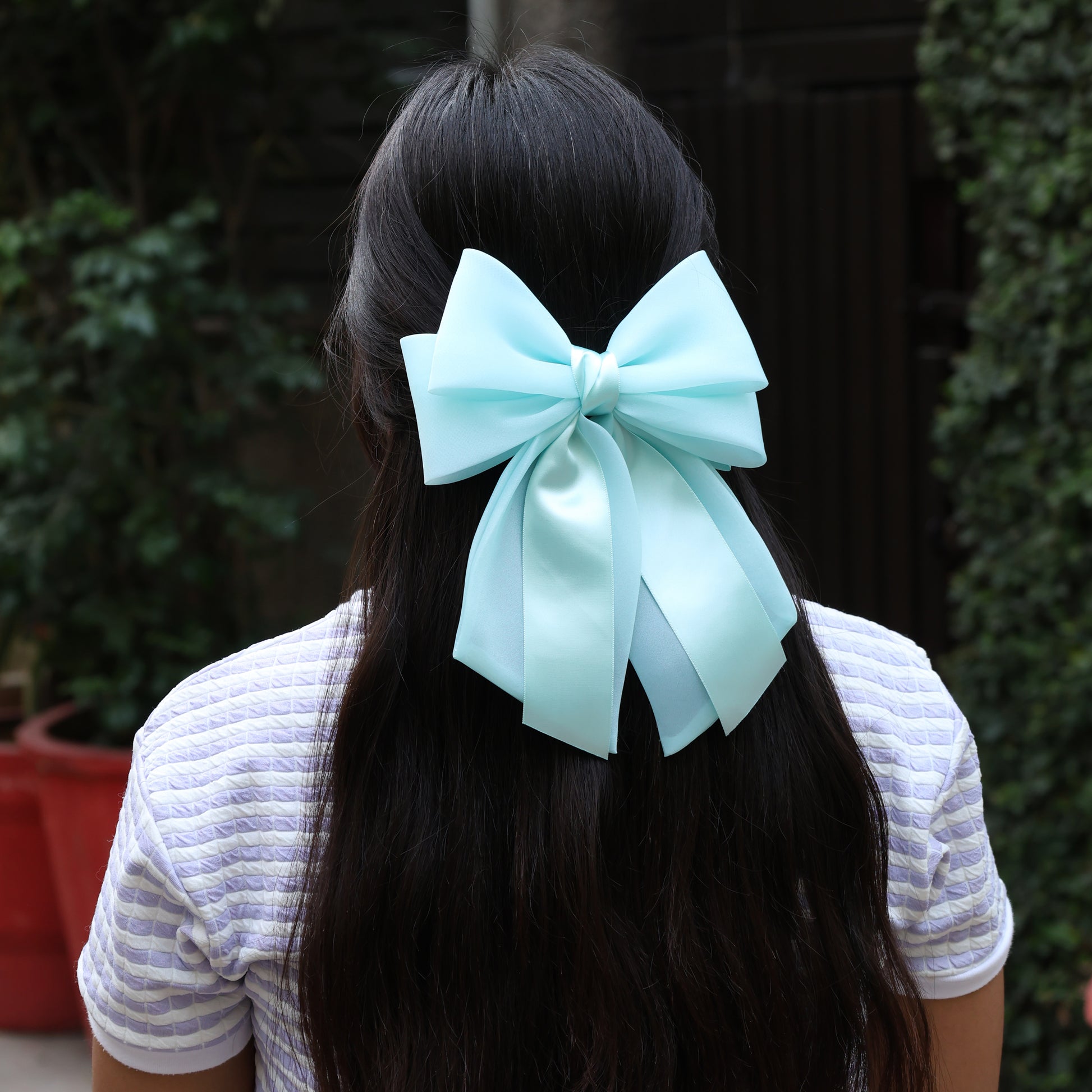 Light blue Organza and Satin Bow Clips worn in long dark hair with a white striped shirt