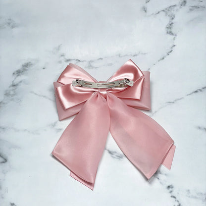 Pink Organza and Satin Bow Clips with metal clip on marble background for hair accessories