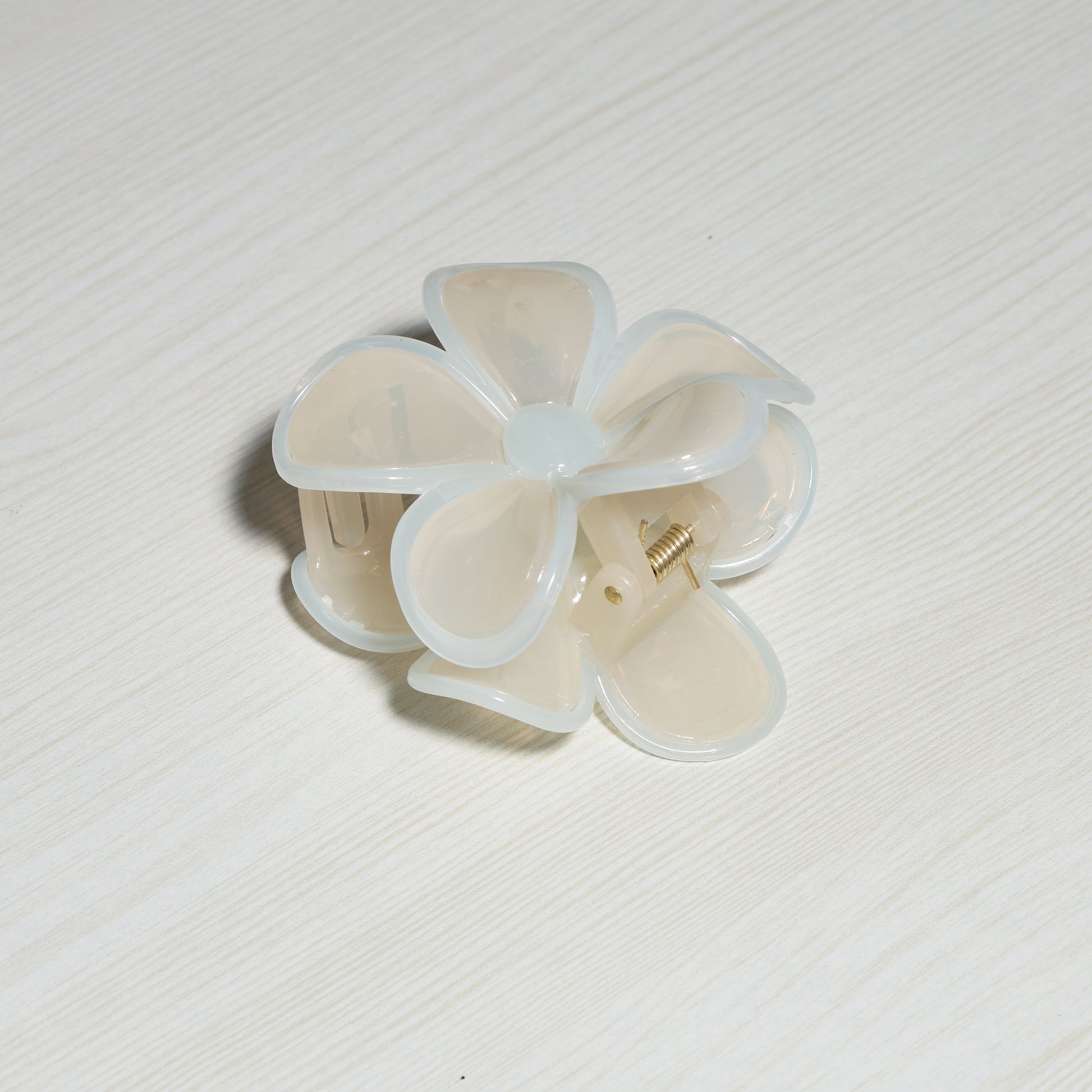 Pearl Finish Single Flower Clutch hair accessory with translucent white petals on light background