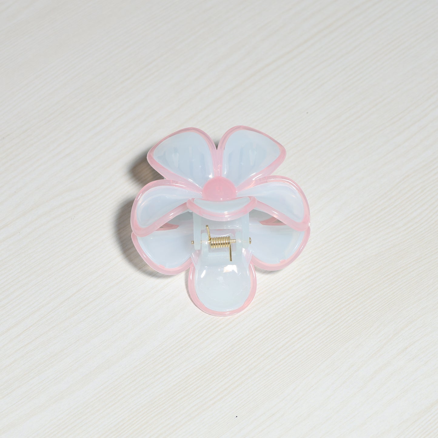 Pearl Finish Single Flower Clutch hair accessory with pink and white petals on light background