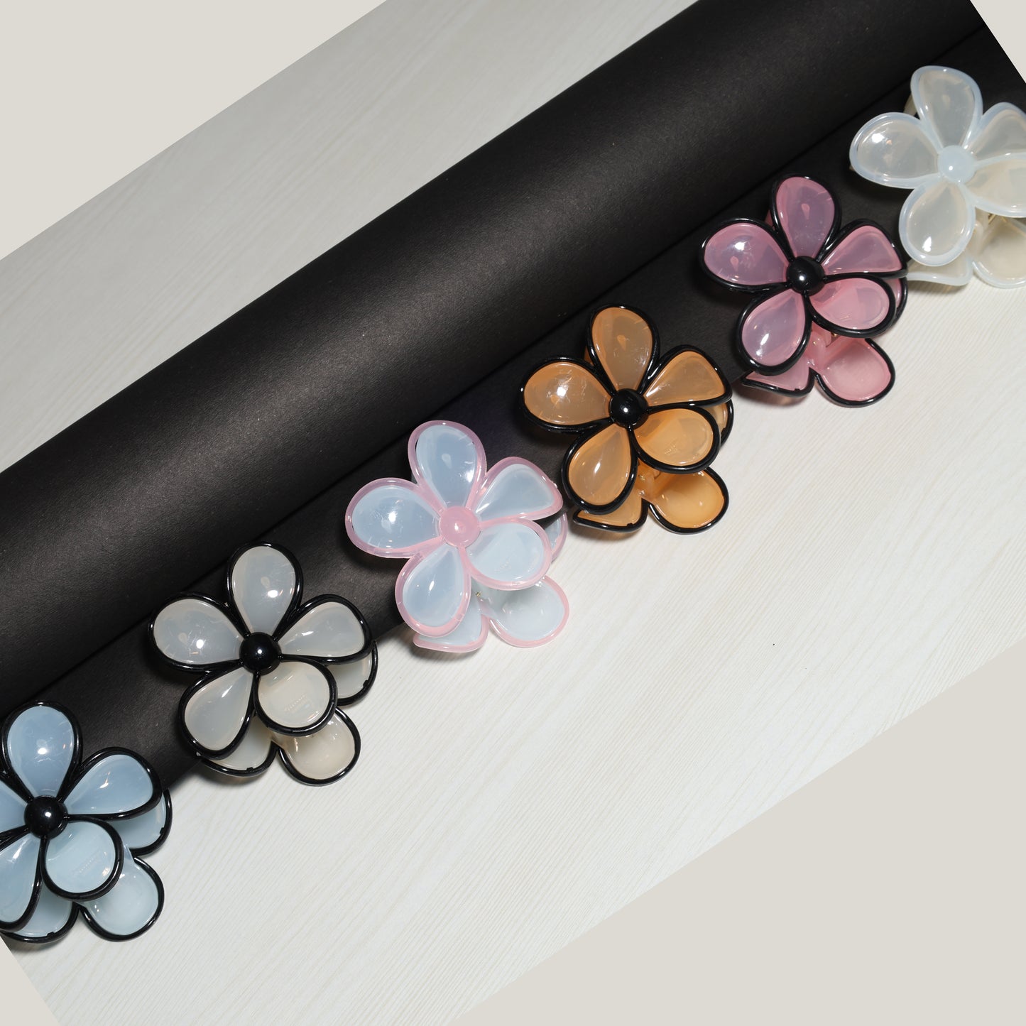 Pearl Finish Single Flower Clutch in multiple colors displayed on black and white background