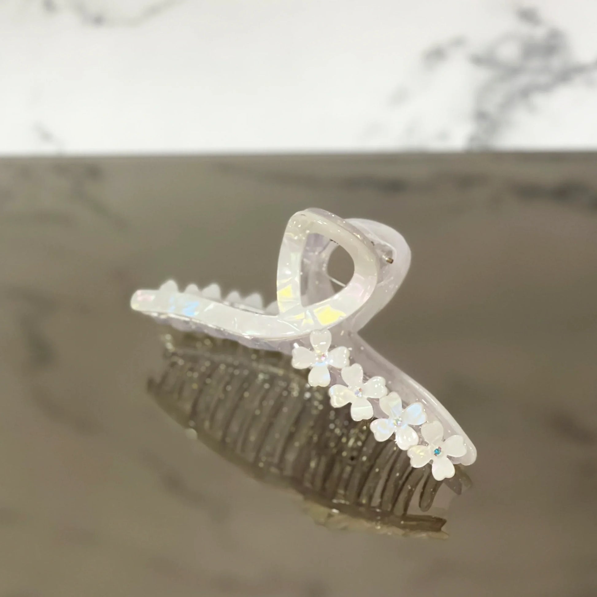 Clear pearl floral hair clutches with small white flower accents for elegant hair styling