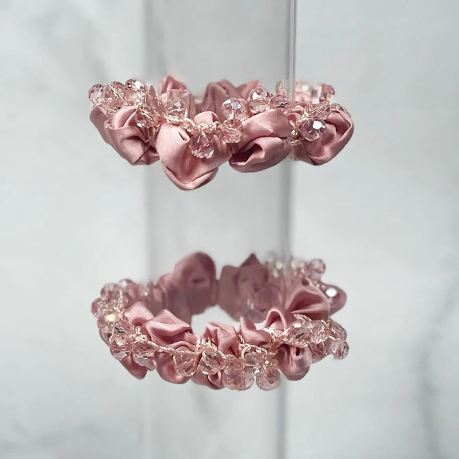Pink satin crystal studded hair ties with decorative clear crystals for stylish hair accessories