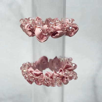 Pink satin crystal studded hair ties with decorative clear crystals for stylish hair accessories