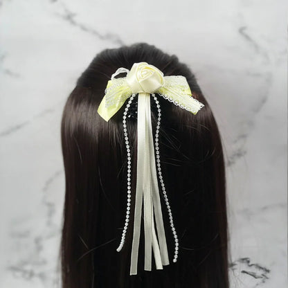 White and yellow rose flower hairpins for kids with ribbons and pearl beads on dark hair