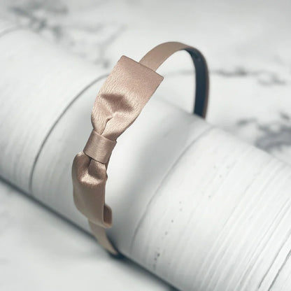 Beige satin bow hairbands with a smooth satin finish for stylish hair accessories