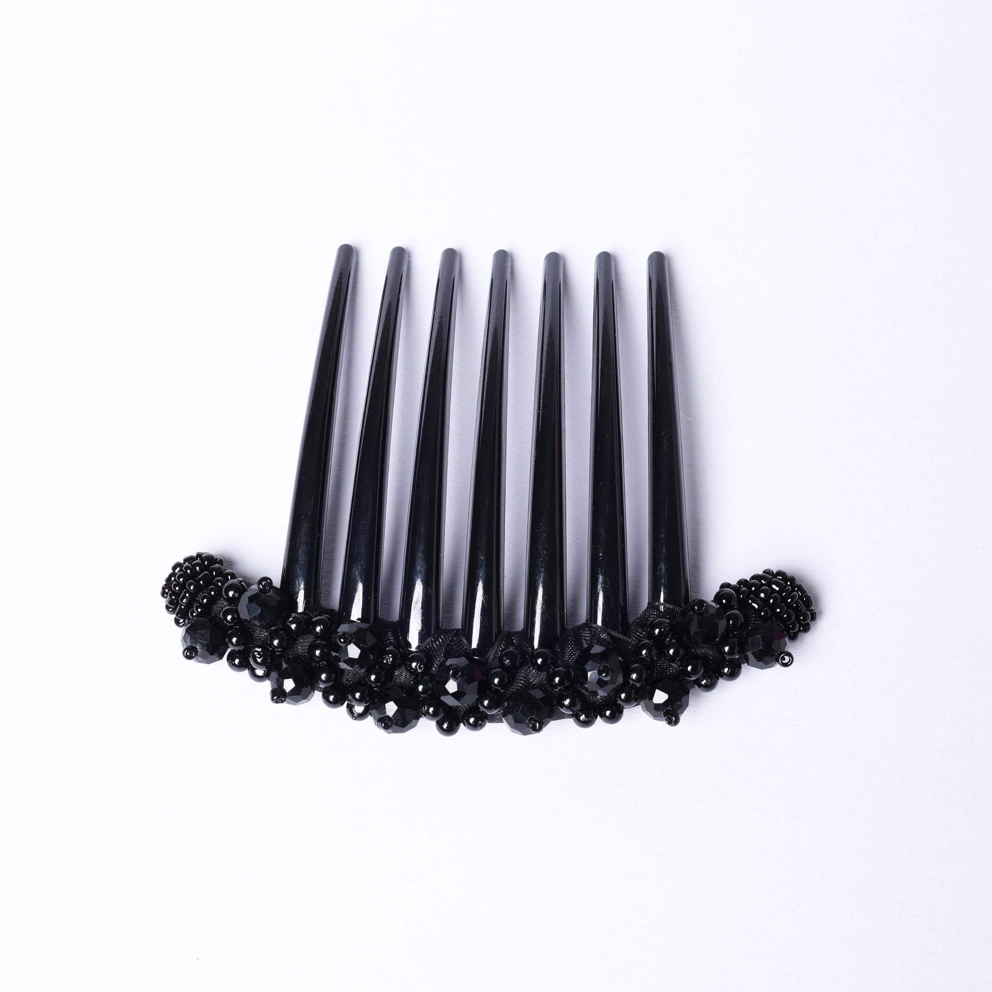 Black studded comb clips with decorative black beads for stylish hair accessory