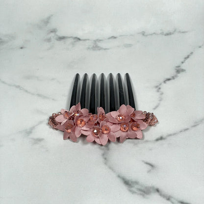 Pink floral studded hair bun comb with gemstones on black teeth for elegant hairstyles
