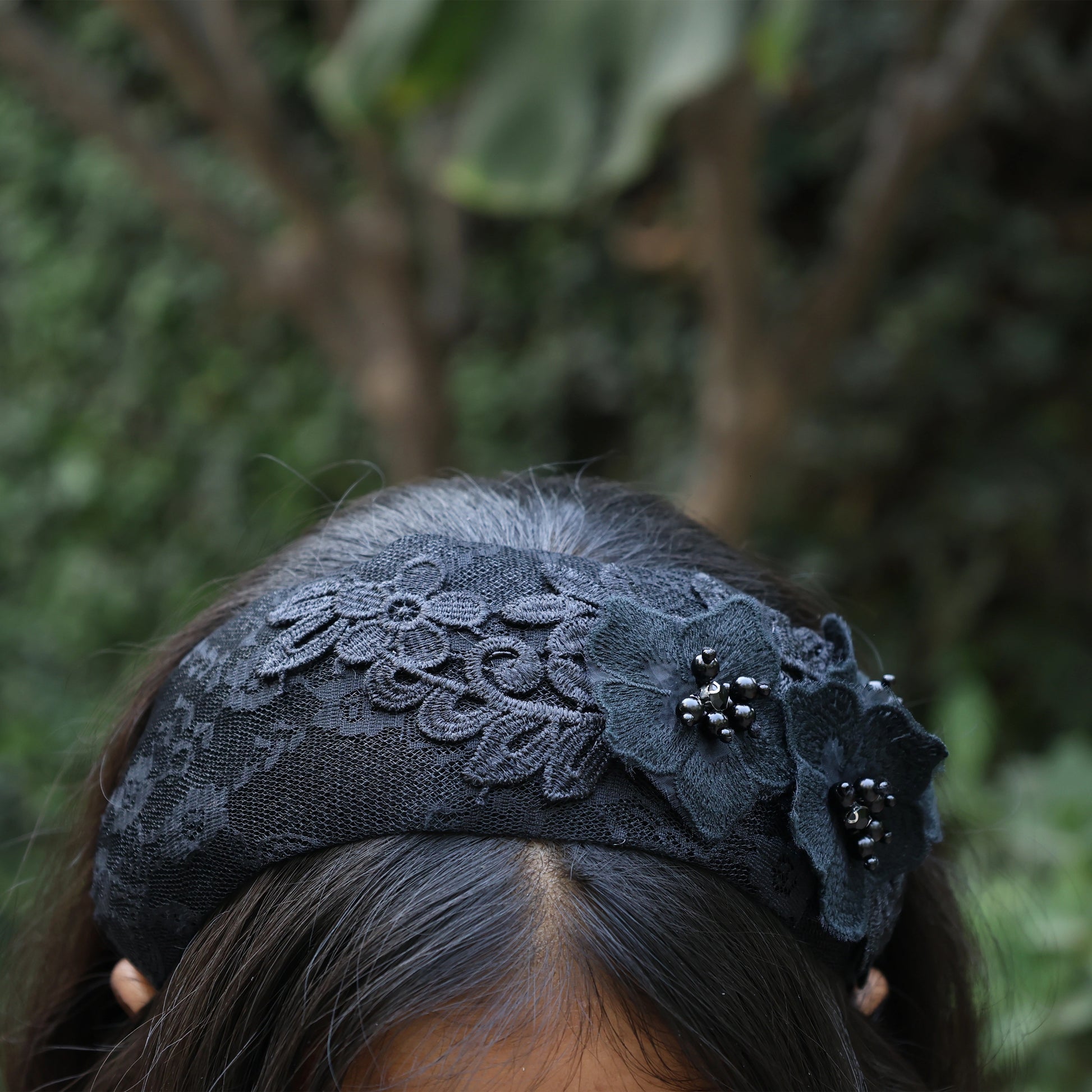 Black lace three flower broad hairbands with bead details worn on dark hair