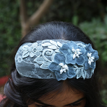 Blue lace three flower broad hairbands with pearl accents worn on dark hair