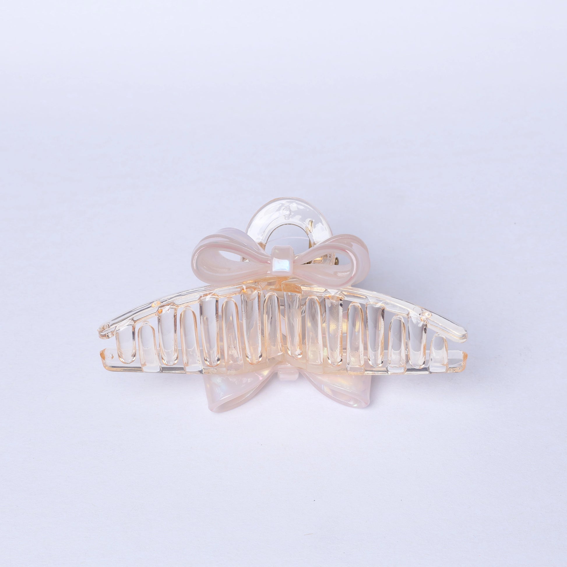 Transparent bow hair clutches with a delicate light pink bow detail for stylish hair styling
