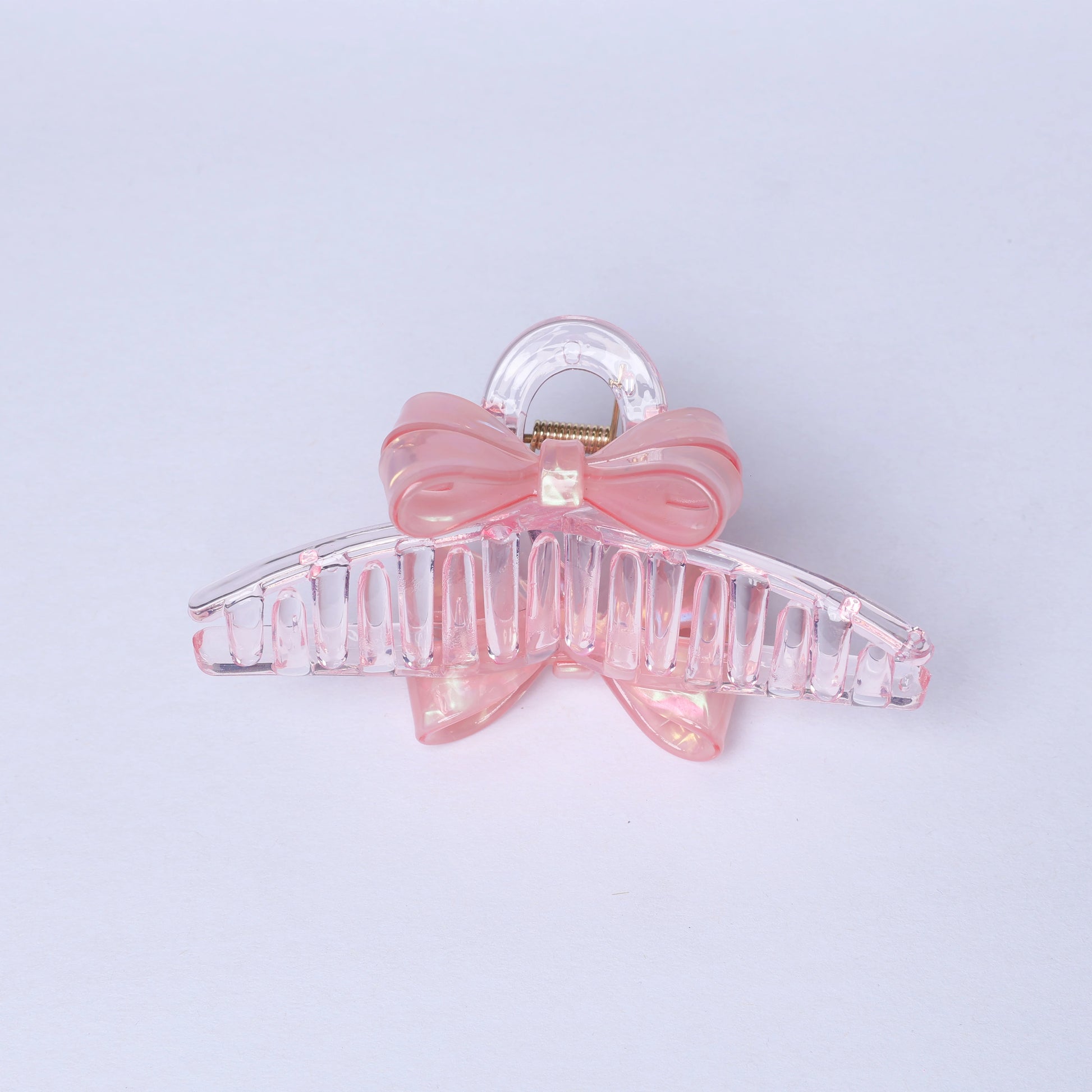 Pink bow hair clutches with clear plastic claw clip for stylish hair hold
