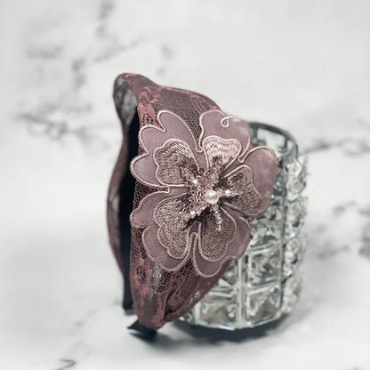 Lacy embellished hairbands for women with large floral lace design and bead accents in soft mauve color