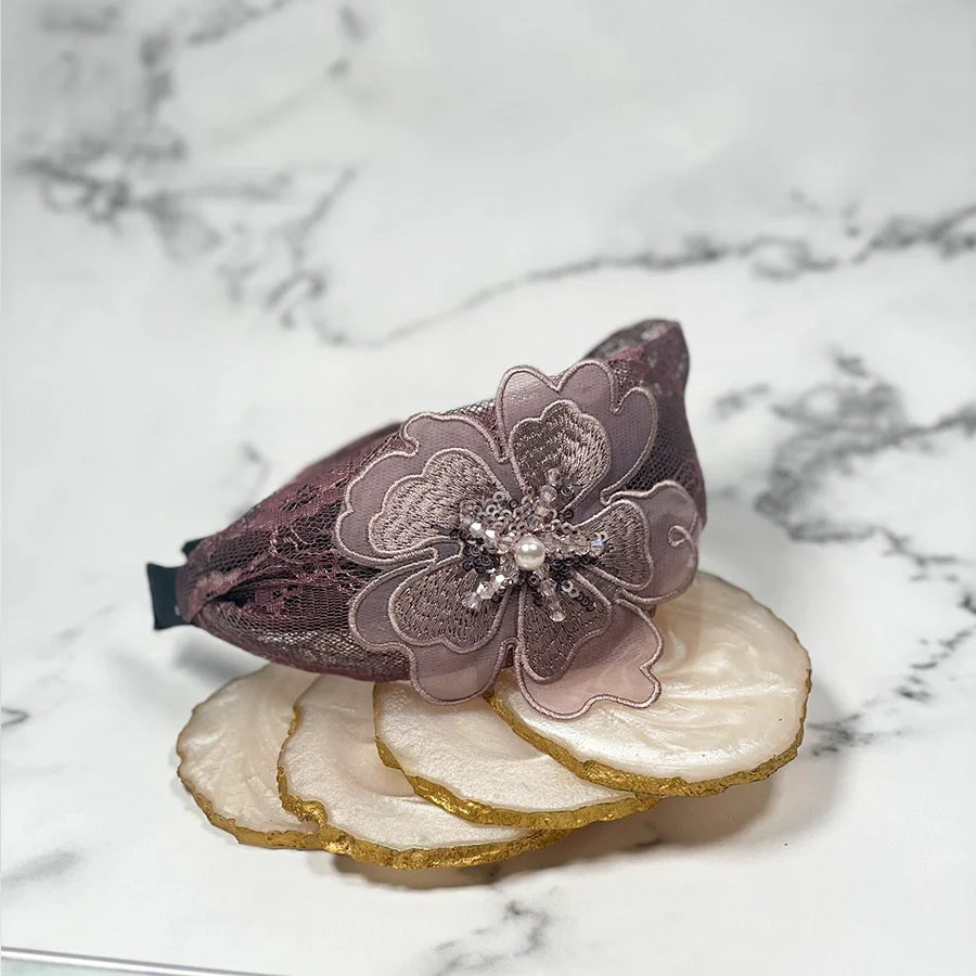 Lacy embellished hairbands for women with intricate floral design and pearl accents in purple