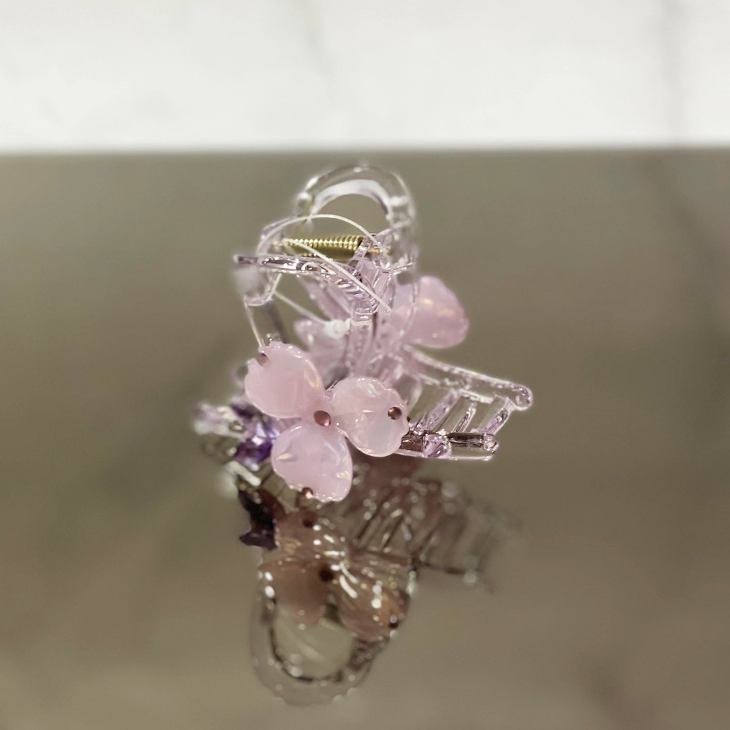 Delicate pearl studded flower hair clutch in light pink with clear acrylic and gold spring detail