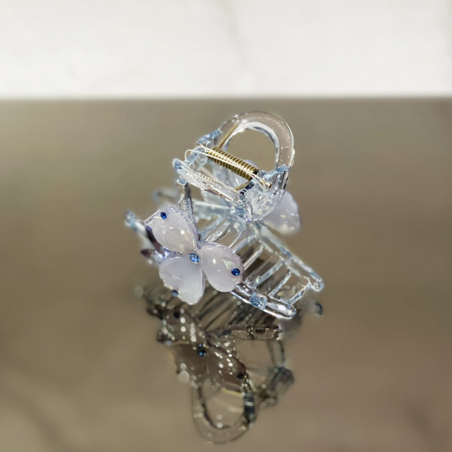 Clear pearl studded flower hair clutch with blue accents and spring clasp from mydevelopmentstor