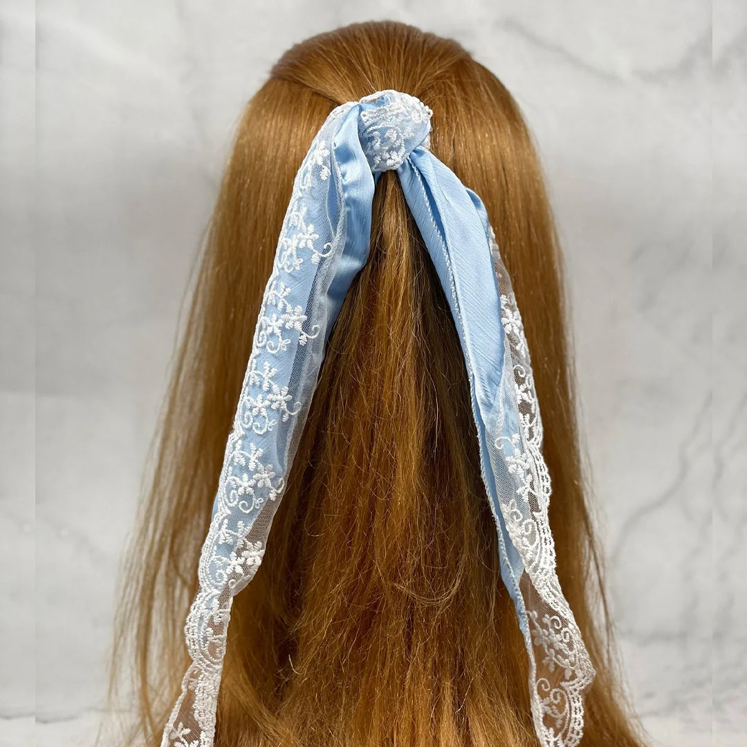 Light blue Synthetic Lacy Hair Scarf tied in long brown hair with delicate white lace details