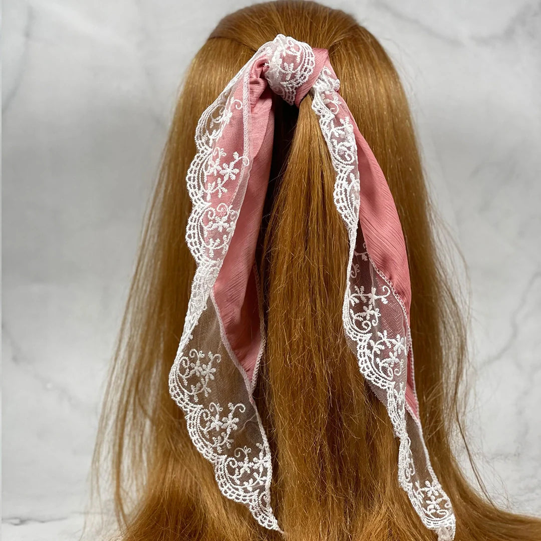 Synthetic Lacy Hair Scarf in pink with white lace tied in long ponytail on brown hair